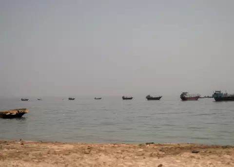 Vessels are anchored in the Strait of Hormuz, as seen from Musandam, Oman, on Friday, June 19, 2026.